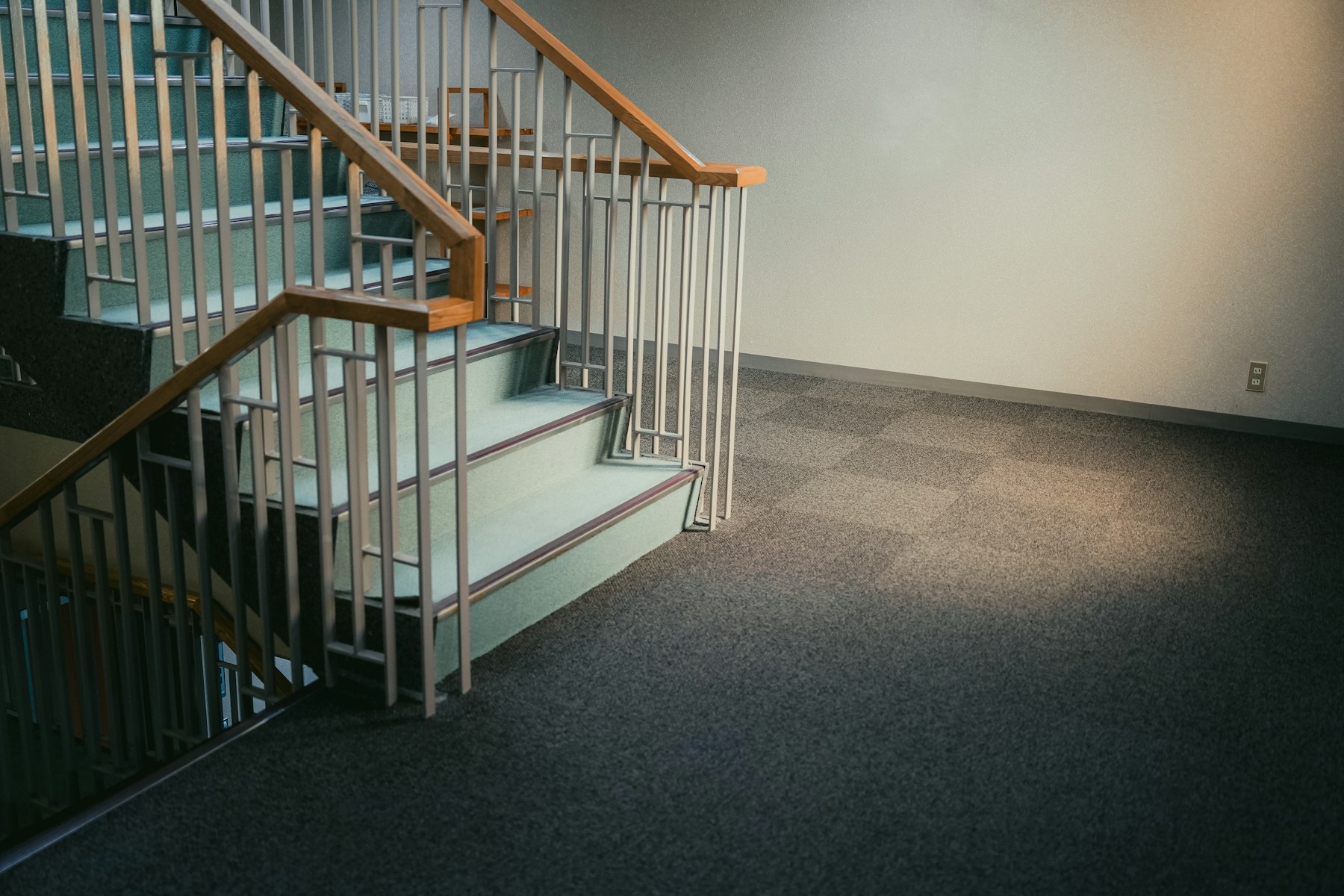 Residential staircase with a tailored neutral carpet runner