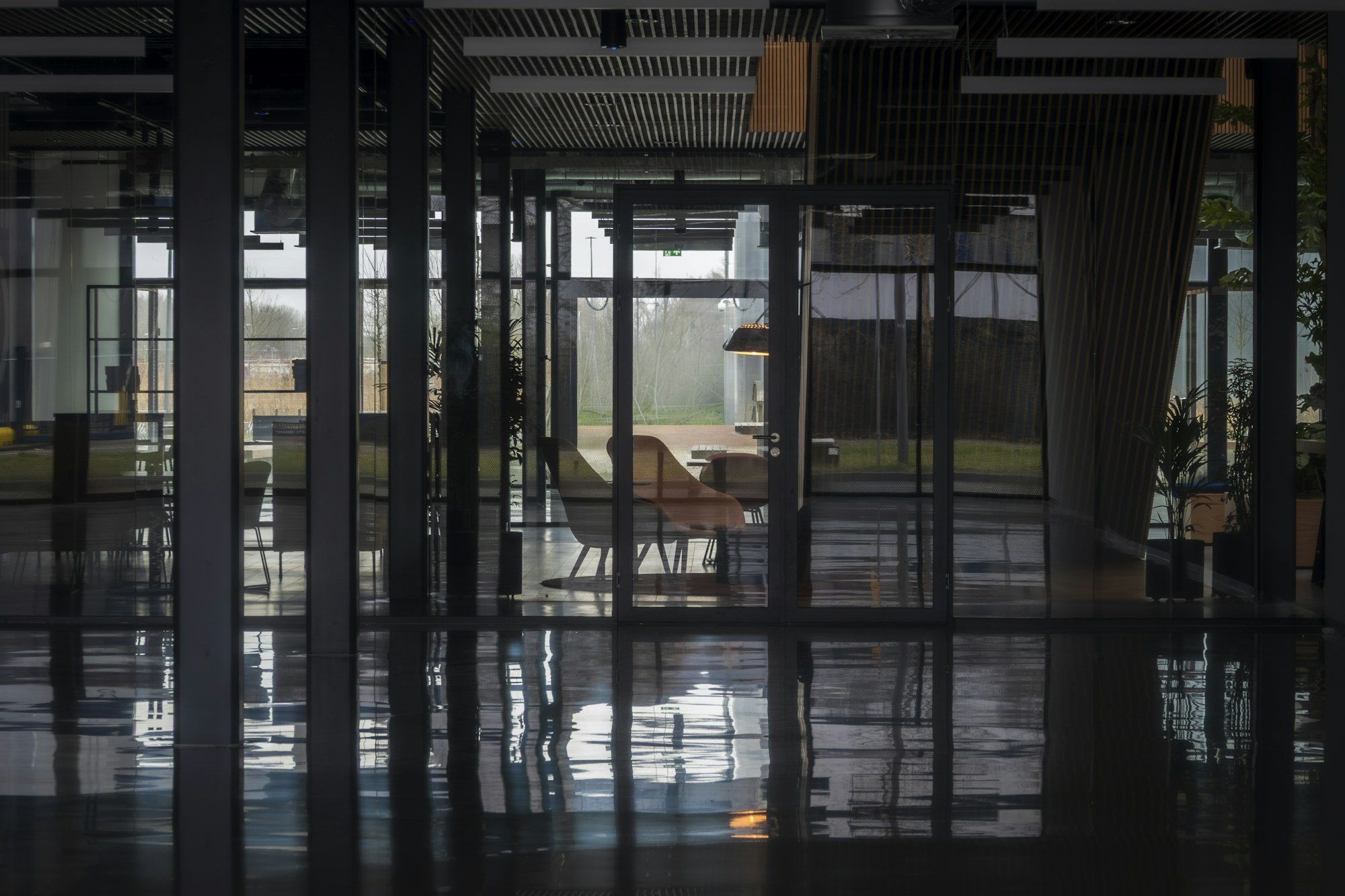 Modern commercial office interior with reflective finished flooring