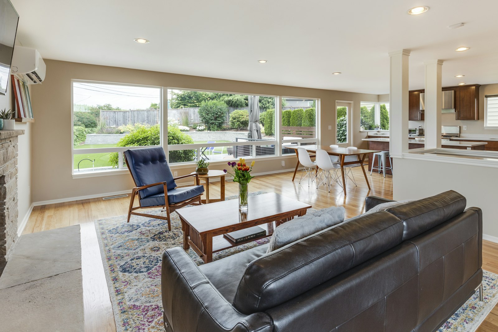 Open-plan home with coordinated wood flooring across living and dining spaces